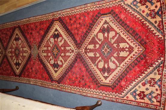 A Hamadan red ground runner, 9ft 3in by 2ft 8in.